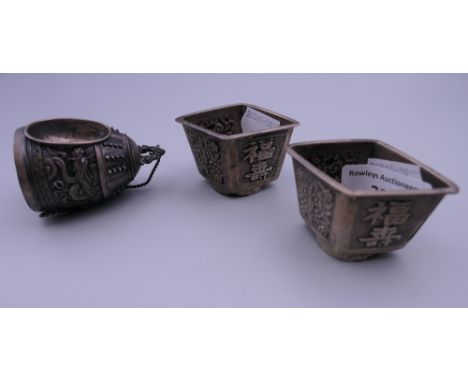 Three Chinese silver salts. The largest 6.5 cm high.