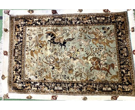 Blue ground silk rug decorated with hunting scenes and with embroidered borders, 170cm x 115cm. Estimate: £60-80.