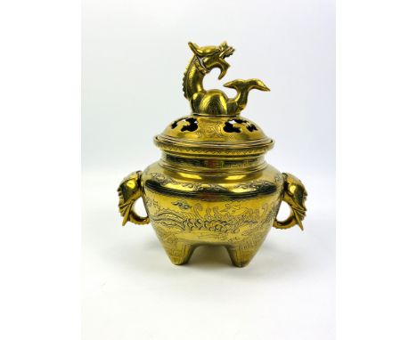 A large heavy early 20th century Chinese polished brass incense burner and cover with engraved decoration throughout and elep