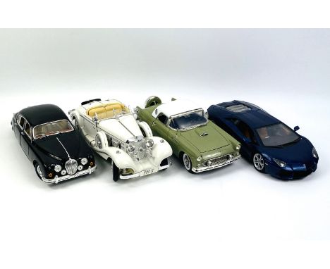 A collection of four large metal 1-18 scale model cars: a 1959 Jaguar MII by Bburago; together with a Lamborghini Aventador L