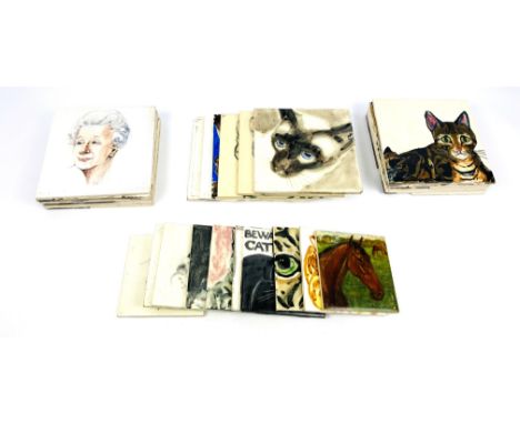 A collection of approximately 28 decorative mainly cat ceramic Pilkington and art pottery tiles which are stamped to the reve