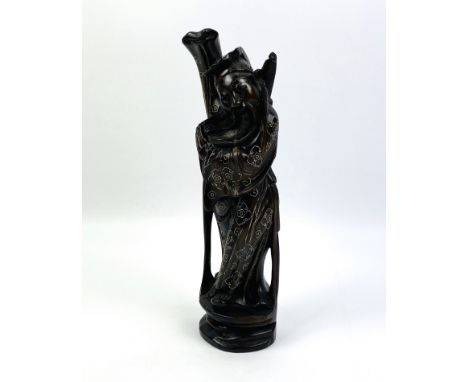 An early 20th century Chinese carved hardwood figure with silver wire inlaid decoration throughout, 8cms wide x 8cms deep x 2