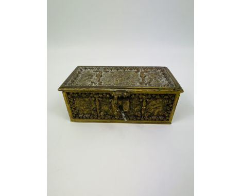 An early 20th century gilt brass renaissance style miniature form casket, well cast decoration throughout, complete with key,
