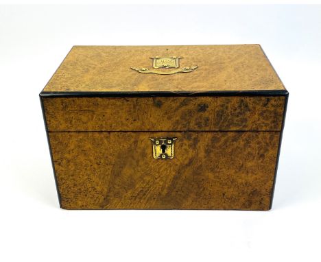 A 19th century brass mounted ebonised and pollard oak tea caddy with two interior hinged dome lidded compartments, original c