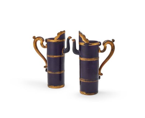 A rare pair of Tibetan inspired Chinese aubergine-blue glazed porcelain ewers, Kangxi, with gilded details, later mounted wit