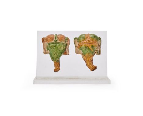 Two Chinese sancai glazed pottery models of elephant heads, Liao Dynasty (916-1125), the animal detailed with almond-shaped e