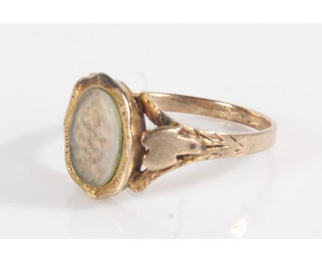 Gold coloured metal mourning ring, the oval head set with a hair panel, ring size N, 1.7g