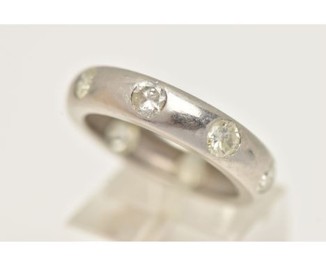 A LARGE PLATINUM ETERNITY BAND RING, a platinum band ring, flush set with eight round brilliant cut diamonds, approximate tot