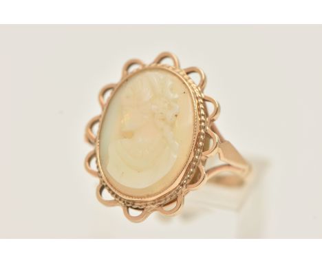 A 9CT GOLD OPAL CAMEO RING, an oval opal carved with a cameo depicting a female portrait, collet set in yellow gold, with sca