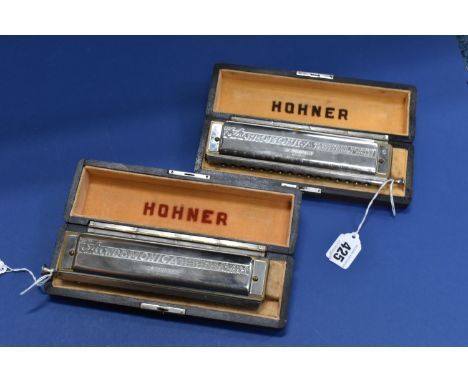 TWO CASED HOHNER 64 CHROMONICA HARMONICAS, both appear complete and in good condition, in original fitted cases which are com