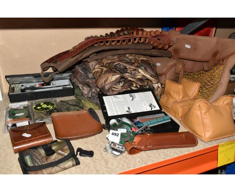 A SELECTION OF ITEMS RELATED TO SHOOTING AND CAMOUFLAGE CLOTHING, to include Tetra Gun Pro Smith cleaning rods and accessorie