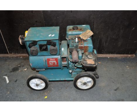 A VINTAGE SWAN GENERATOR rated at 1-2KVA with 110v and 230v outputs (engine pulls freely but hasn't been started) (Condition 