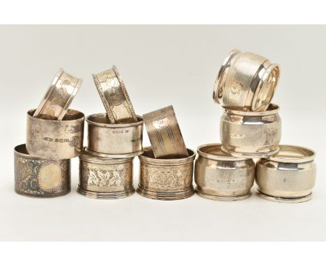 A PARCEL OF SILVER NAPKIN RINGS, four engine turned pattern rings with engraved cartouche, hallmarked Birmingham, two with iv