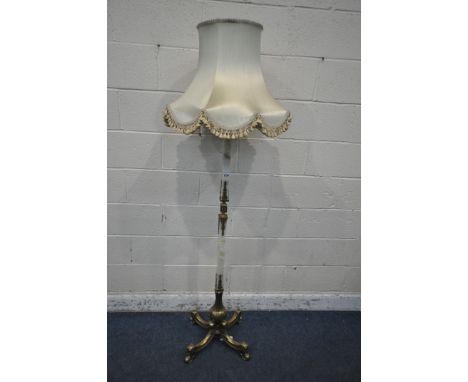 A BRASS AND ONYX STANDARD LAMP, raised on four shaped legs, height to fitting 156cm (condition report: wear to shade, lamp in