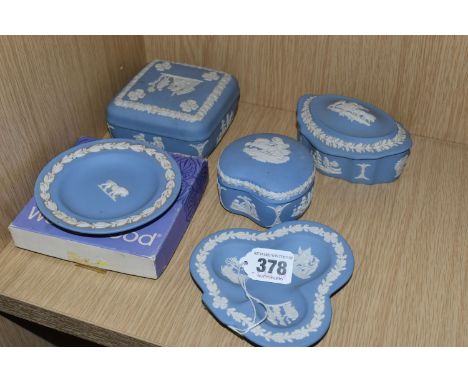 FIVE PIECES OF WEDGWOOD PALE BLUE JASPERWARE, comprising a boxed Leo pin dish, a club shaped pin dish, and three trinket boxe