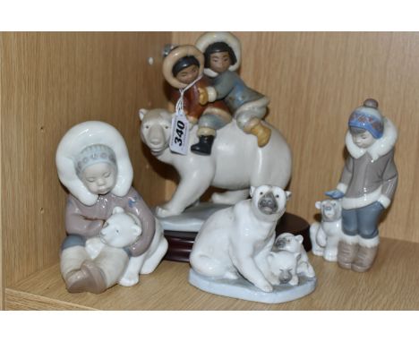 A GROUP OF FOUR LLADRO FIGURES, comprising a Lladro Grés Eskimo riders, model no 2270 with wooden plinth, 'Eskimo Boy with Po