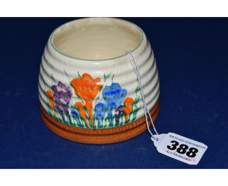 A CLARICE CLIFF 'CROCUS' HONEYPOT BASE, painted with orange, blue and purple crocus flowers on a cream ground, green printed 