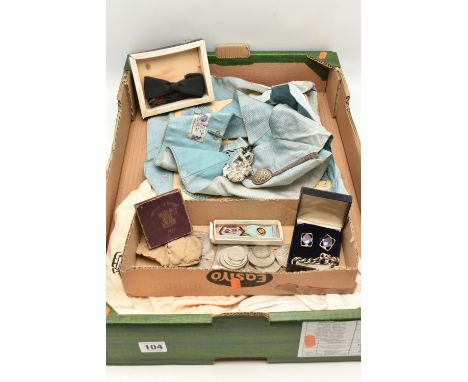 A BOX OF ASSORTED MASONIC REGALIA, to include an apron, a sash, gloves and a medal, also including a selection of coins
