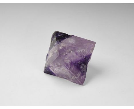 A fine, large cleavage octahedron of banded purple and lavender fluorite with strong colour-banding, from the Tri-State area 