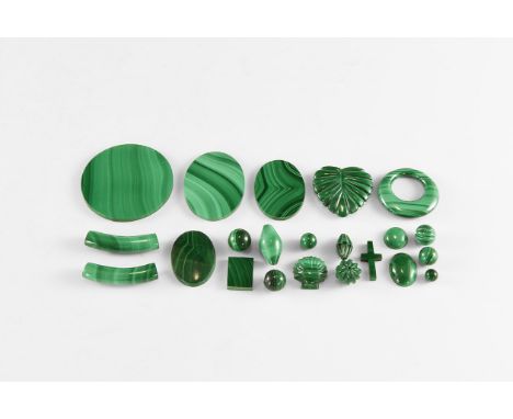 A group of twenty two mostly one-off malachite carvings, cabochons and beads, some drilled, some fluted, of good quality mala