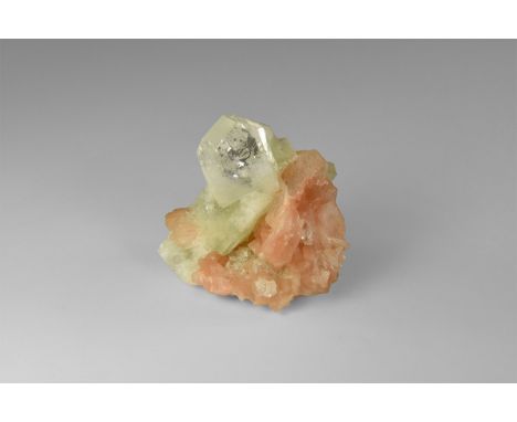 An attractive specimen of colourless apophyllite and pink stilbite, from India, with two large apophyllite crystals inter-gro