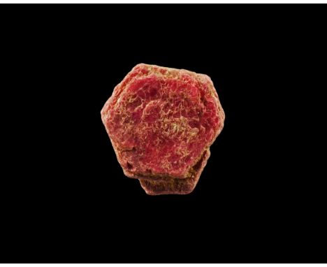 A hexagonal, richly-coloured, tabular ruby crystal with penetrating smaller ruby crystal, in old white card tray with label r