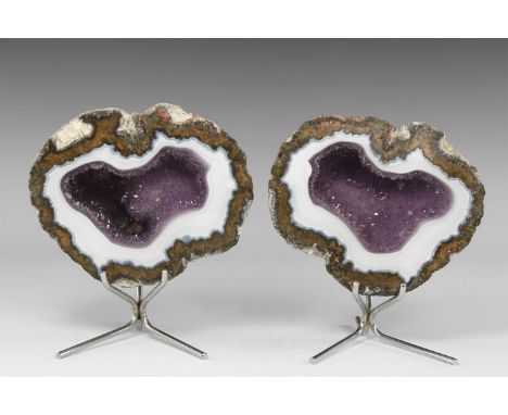 A dramatic pair of white agate-lined, amethyst geodes, with stands. From the historic ‘Victorian Museum’ collection of Gregor