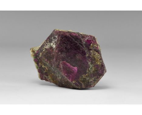 A large, single dark red, tabular ruby crystal, with polysynthetic twinning striations on termination face, probably from Tan