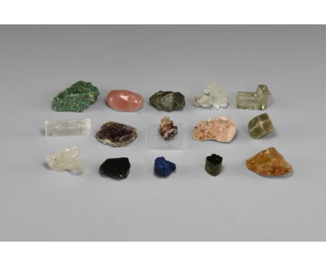 A boxed group of fifteen mineral specimens, each individually presented in a white card tray with label, including: green Ice