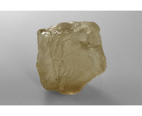 A very large river-rounded cobble of colourless gem quality topaz from Nigeria, interior visible through one side. Found Nige