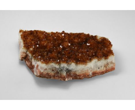 A crust of dark, richly coloured, red- brown citrine crystals on a base of white quartz, from Brazil. Found Brazil; from the 