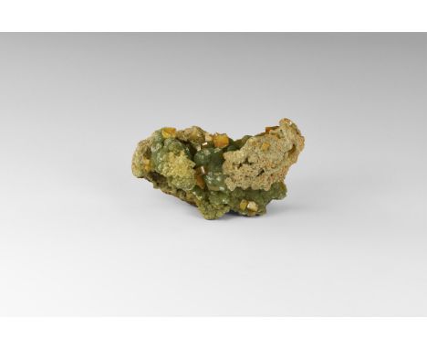 A matrix specimen of green, globular aggregates of adamite crystals, with orange, tabular wulfenite crystals, from Mexico, in