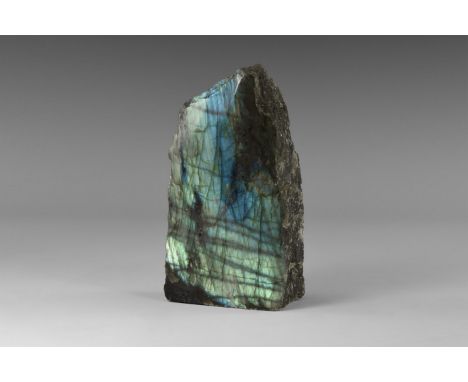 An exceedingly fine specimen of labradorite, polished on one side, with blue, yellow, and green 'schiller' on the entire poli