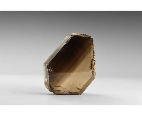 A 33 mm thick section of highly transparent smoky quartz with colour zoning from dark to light black, polished on both sides 