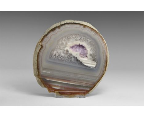 A 22 mm thick polished agate slab with an unusual combination of red, blue, and blue-grey banded and fortification agate with