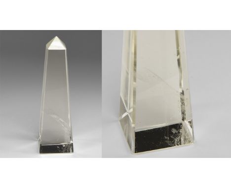 A finely made obelisk of rock crystal quartz, near-flawless with an attractive veil of fine bubbles in the lower third. From 