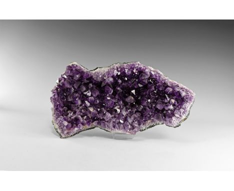 A large sheet of fine amethyst crystals on a quartz and agate base, from Brazil. Found Brazil; from the historic ‘Victorian M