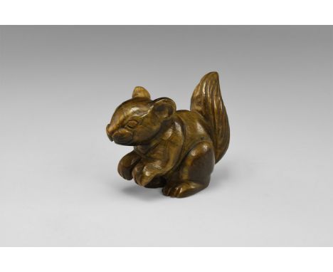 A cute, sitting squirrel nicely carved in gold tiger's eye. From the historic ‘Victorian Museum’ collection of Gregory, Bottl