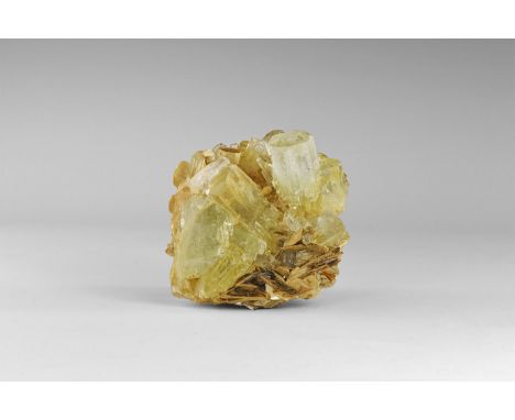 A cluster of mostly gem-quality light green, very well-formed, lustrous aquamarine crystals on matrix, with accessory muscovi