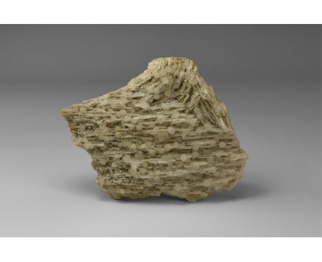 An unusual specimen consisting of several dozen near-spherical white calcite crystals on a sheet of white bladed barite, from