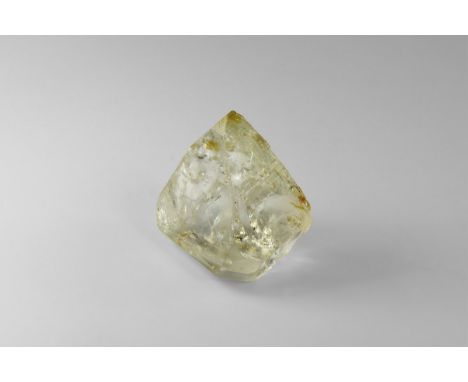 A well-formed topaz crystal from Brazil, with primarily termination faces, slight greenish cast to stone, in old white card t