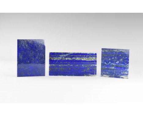 A group of three gem-quality, rectangular lapis lazuli plaques from Afghanistan illustrating the types of occurrence, polishe