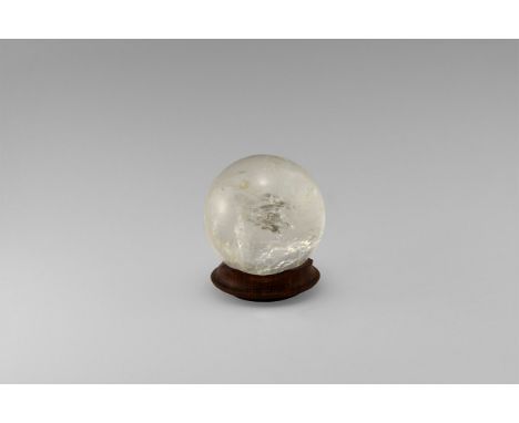 A fine quartz sphere with internal features causing colour-dispersion, creating numerous 'rainbow' effects, with antique turn