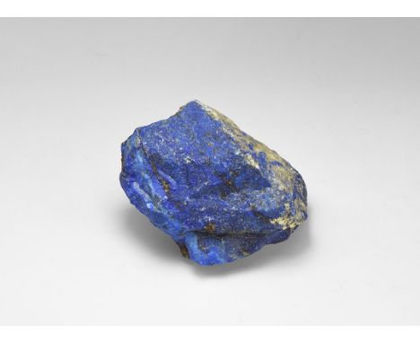 A piece of very high quality intense blue uncut lapis lazuli with good pyrite layering, from Chile. Found Chile; from the his