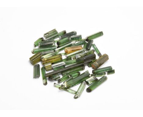 A group of fifty small, gem quality green tourmaline crystals. From the historic ‘Victorian Museum’ collection of Gregory, Bo