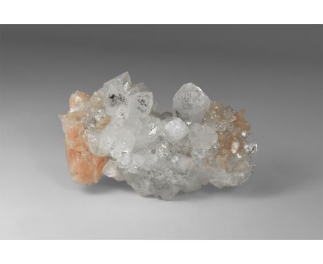 A fine specimen of the zeolites apophyllite and stilbite from India, with a number of colourless apophyllite crystals flanked