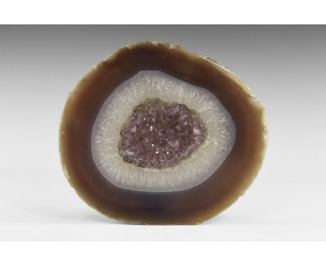 A thick slab (20mm) of blue-grey Brazilian agate with a white agate band and an amethyst centre. Found Brazil; from the histo