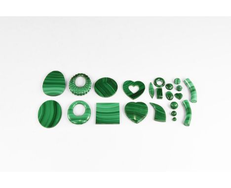 A group of twenty two mostly one-off malachite carvings, cabochons and beads, some drilled, some fluted, of good quality mala