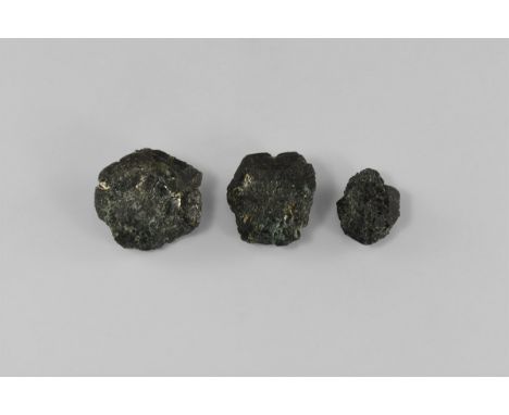 A group of three chrysoberyl trillings showing various twinning faces and twinning planes, with some minor colour change, fro