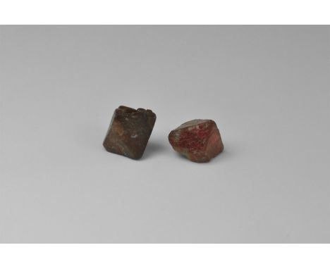 Two octahedral crystals of red spinel, one complete, one with unusual growth faces on the bottom half, from Myanmar, ex Chris